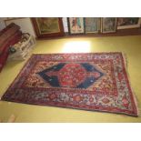 A 20th century Persian rug, with central