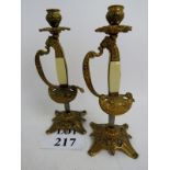 A pair of decorative gilt-metal candlest