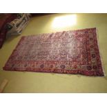 A 20th century Persian rug with central