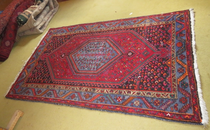 An Iran rug with Kayan label (wear to fr