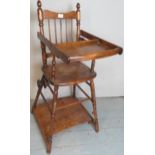 A pretty Victorian style oak turned high chair with spindle back and metal wheels est: £40-£60