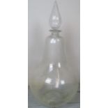 A large single bulbous glass chemist bottle with cut glass stopper,