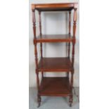 A late Victorian mahogany four tier square whatnot with turned supports and in clean condition est: