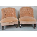 A pair of Victorian low nursing chairs upholstered in beige/cream button backed material and