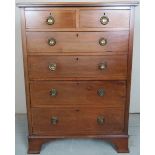 An Edwardian mahogany chest of two short over four long drawers with ebony stringing and brass ring