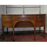 A good quality Edwardian 'Georgian-Revival' inlaid mahogany sideboard with a brass gallery curtain