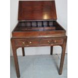 A Georgian mahogany clerks desk with a lift up writing slope to top revealing a fitted interior