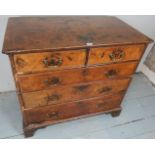 An early 18th Century walnut and oak chest of two short over three long graduated drawers with