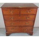 A George III oak chest of two short over three long graduated drawers with brass swan handles and