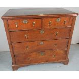 A fine 18th Century oak split chest of two short over three long graduated drawers with decorative
