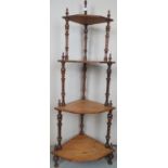 A Victorian mahogany and inlaid four tier whatnot with turned mahogany upright supports and