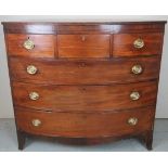 A large 19th Century mahogany bow front chest of three short over three long drawers with brass