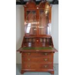 A good quality 20th Century mahogany bureau bookcase with a double arched top over glazed doors