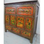 A late 19th / early 20th Century Tibetan cabinet with two short drawers over a central cupboard,