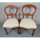 A pair of walnut balloon back chairs, up