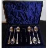 A set of six silver teaspoons and matchi