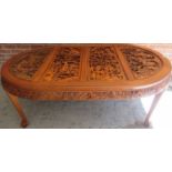 A 20th Century oriental heavily carved d