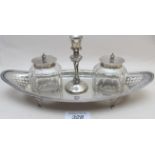 A silver inkstand with two inkwells, wit