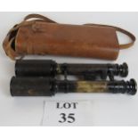 Pair of binoculars in leather case, mark