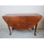 A George III mahogany drop leaf pad foot