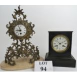 An ornate Rococo-style gilt-metal cased mantel clock, marbled base,