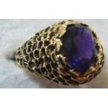 A 14ct gold ring inset with amethyst est