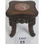 Chinese carved wooden stand with inset m