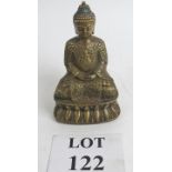 A Chinese figure of Buddha in brass seat