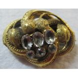 A Victoria brooch inset with six crystal