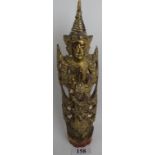 A Tibetan carved giltwood deity applied