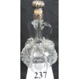 A 19th century engraved glass decanter with twin handles, applied decoration,