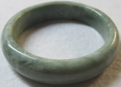 A Chinese jade style bracelet, boxed est