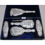 A silver Art Nouveau dressing table set,