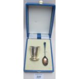 A modern silver egg cup & spoon, fully h