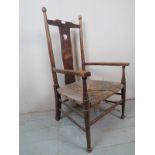 An Arts & Crafts country chair with rush