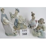 Three Lladro groups depicting a girl wit