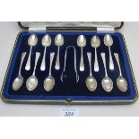 A set of twelve silver coffee spoons wit