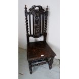 A Victorian carved oak hall chair with t