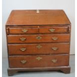 A Georgian oak bureau with a fall front