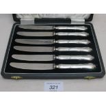 A set of six silver handled tea knives,