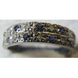 A two line diamond and sapphire ring, pr