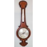 An 19th century oak barometer with appli