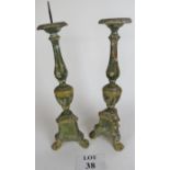 Pair of ornate wooden altar candlesticks, with lions paw feet, a/f,