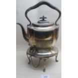 A complete silver kettle on original sta