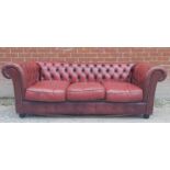 A 20th Century red leather deep buttoned Chesterfield three seater sofa in good condition est: