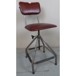 A vintage industrial steel framed swivel chair upholstered in red est: £40-£60