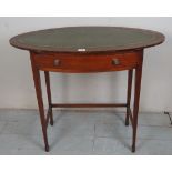 An Edwardian oval mahogany writing table with an inset green leather top above a frieze drawer est: