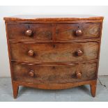 A 19th Century mahogany bow front chest of two short over two long drawers with turned handles est: