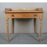 A late 19th Century pine dressing table with a long frieze drawer and turned legs est: £50-£80