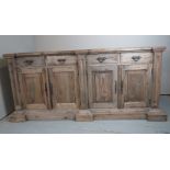 A rustic pine sideboard with four frieze drawers over cupboards est: £80-£120